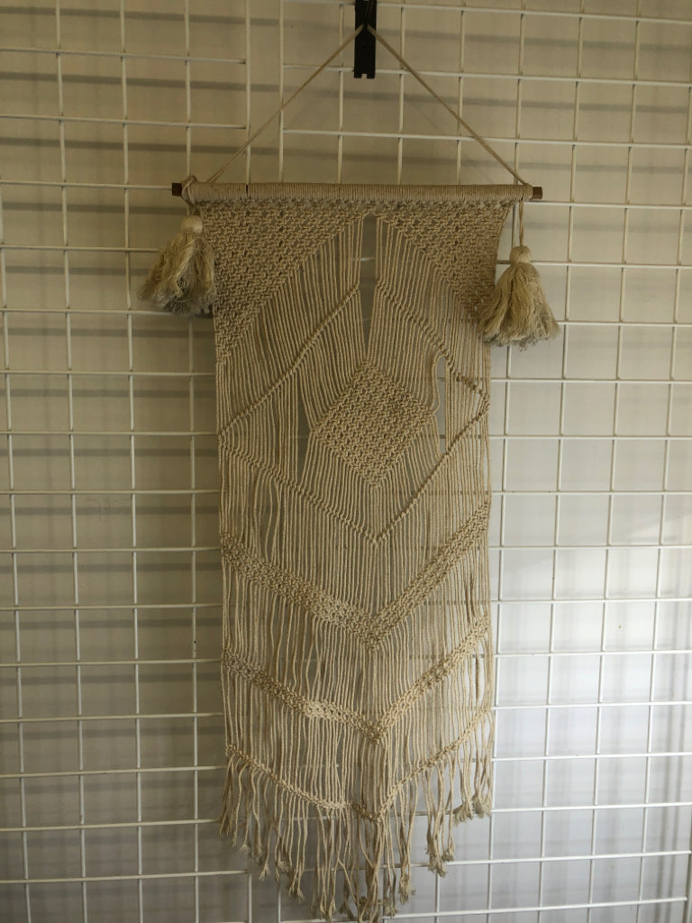 MACRAME WALL HANGING ON DOWEL W/ LARGE TASSELS.