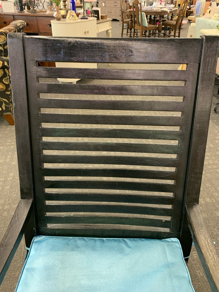 BLACK ROCKING CHAIR W TEAL CUSHION.