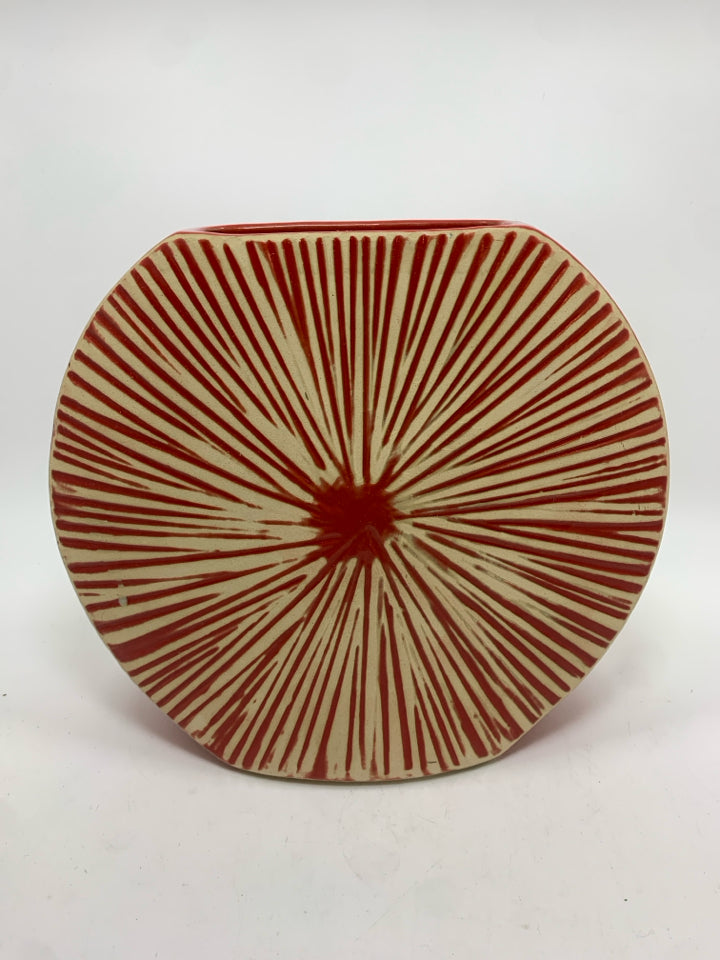 THIN RED VASE W/SUN PATTERN.