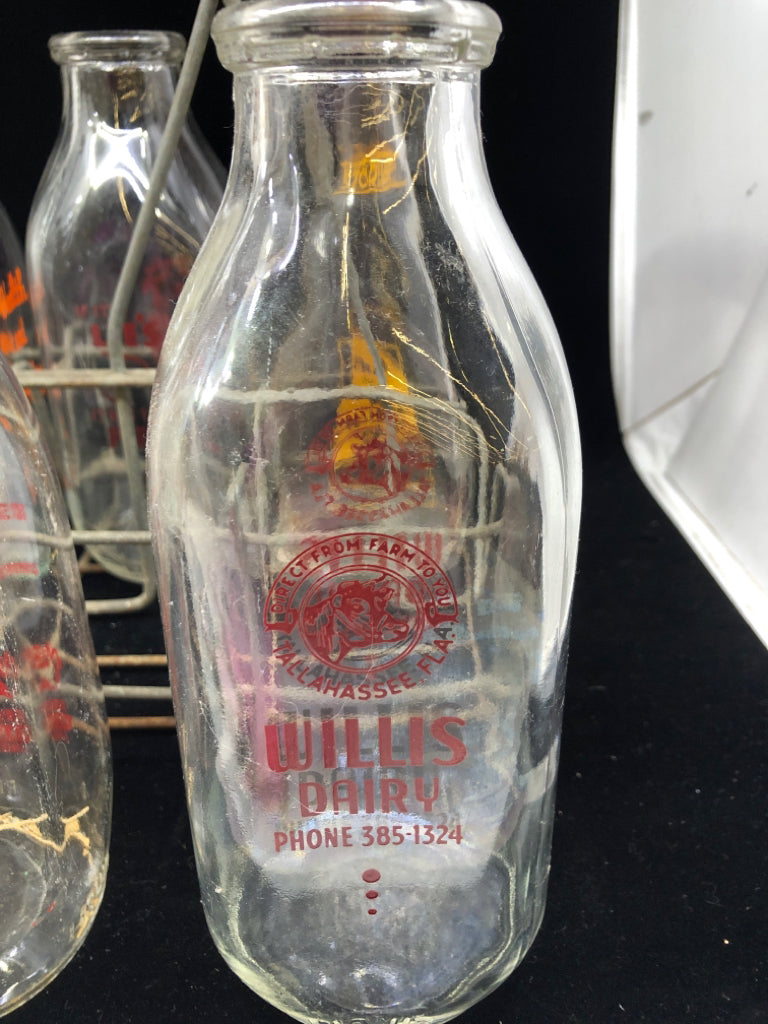 METAL CRATE + 8 DECORATIVE VTG MILK BOTTLES.