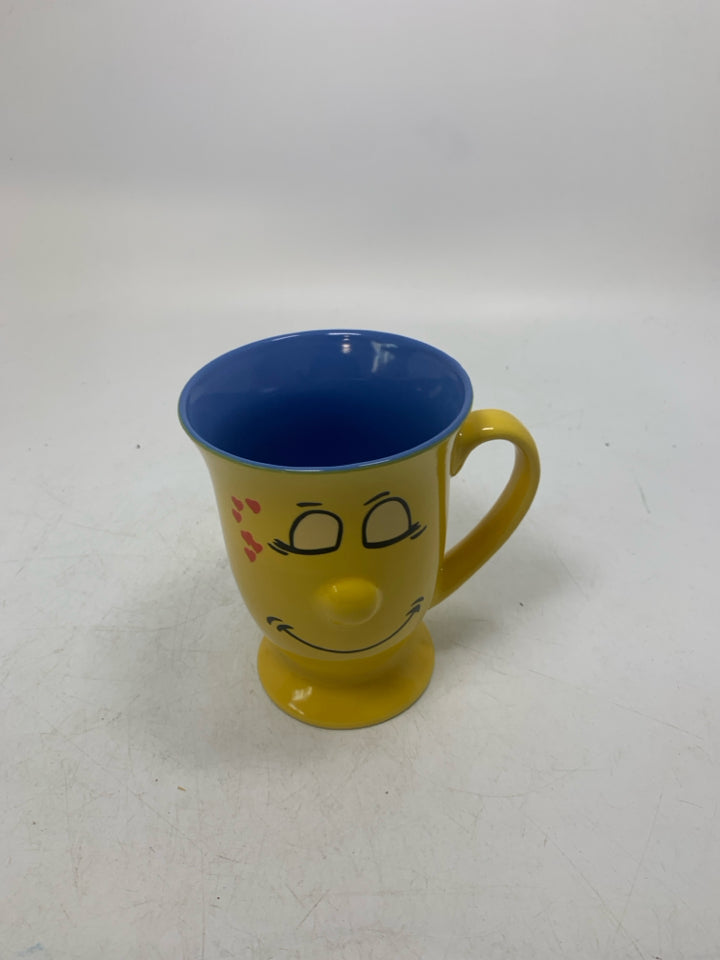 FOOTED SMILEY FACE MUG W/ BLUE INSIDE.