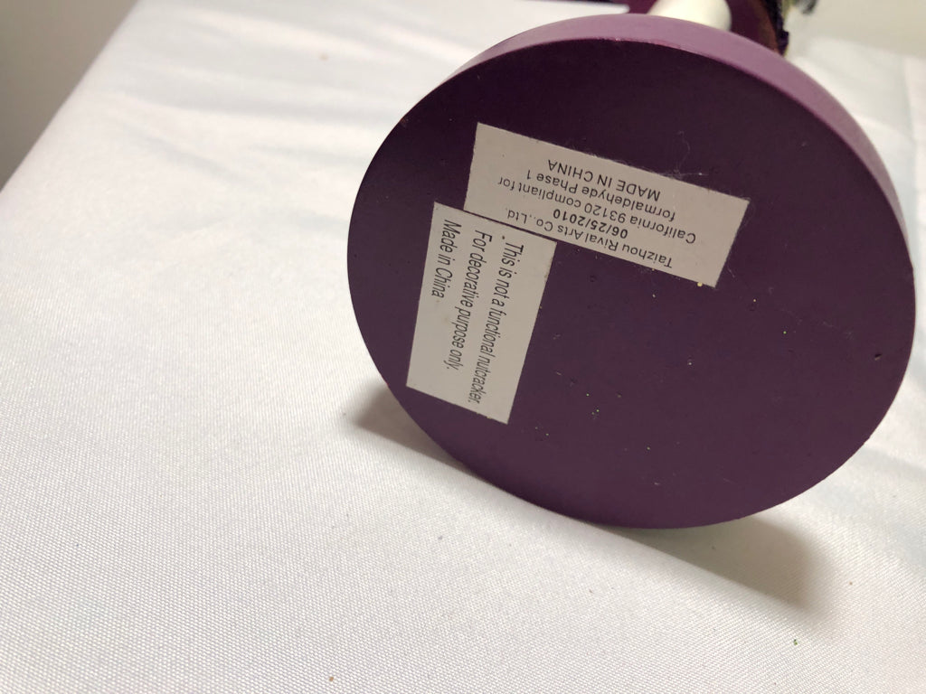 PURPLE SEQUIN NUT CRACKER.