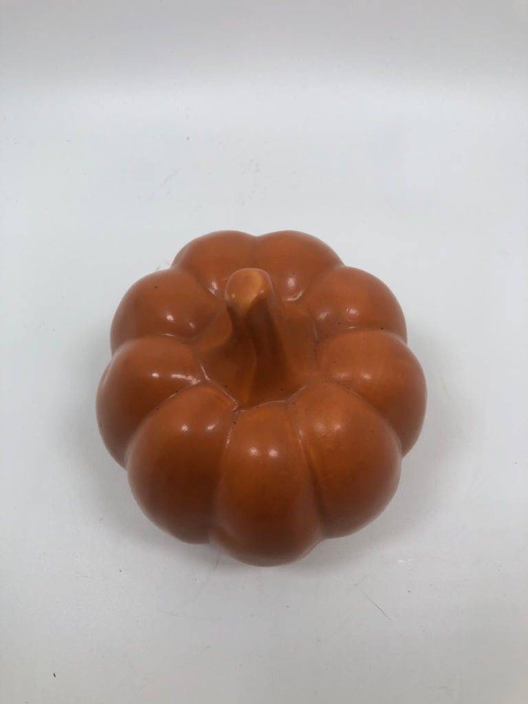 ORANGE CERAMIC PUMPKIN FIGURINE.