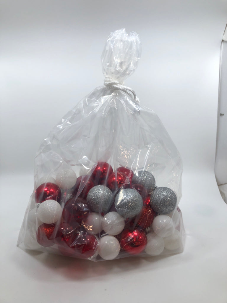 BAG OF RED/WHITE/SILVER GLITTER PLASTIC ORNAMENTS.