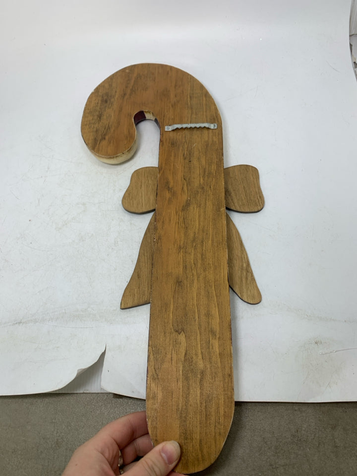 PRIMITIVE STYLE CANDY CANE W/ RED BOW WALL HANGING.