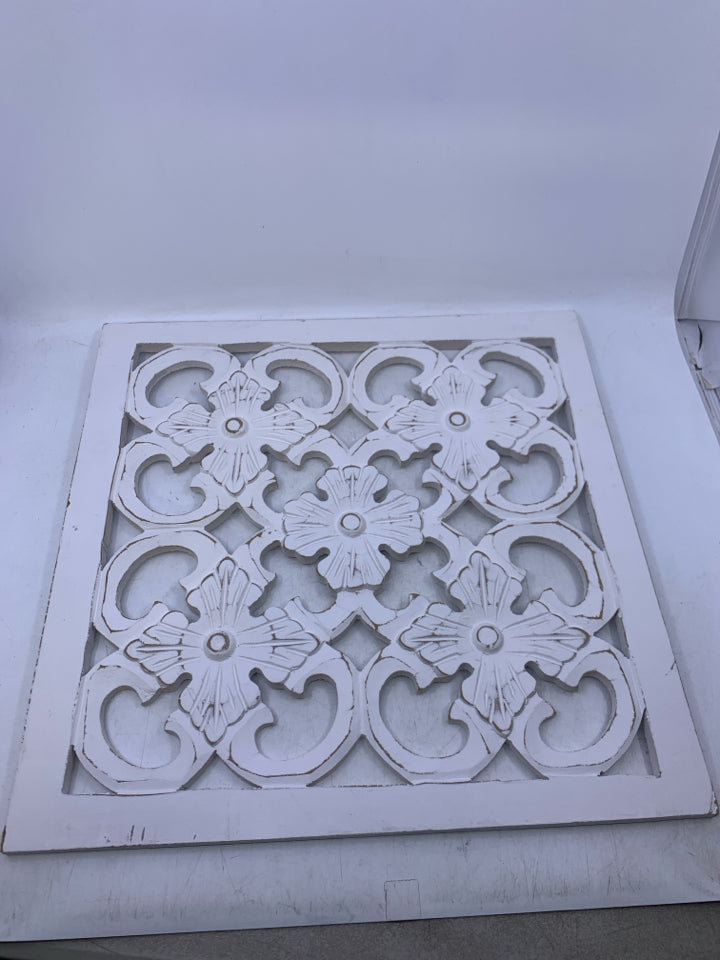 SQUARE WHITE WOOD CUTOUT WALL HANGING.