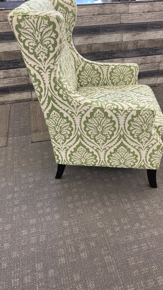 UPHOLSTERED GREEN PATTERNED ACCENT CHAIR.