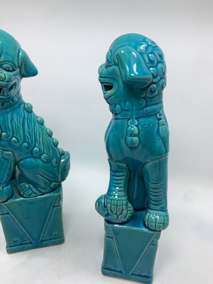 2 BLUE GLAZED FOO DOG STATUES.