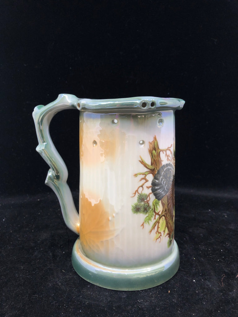 VTG WHITE/GREEN CERAMIC STEIN WITH BLACK BIRD.