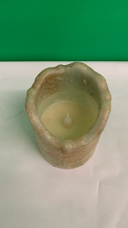 FAUX LIGHT UP BATTERY CANDLE.