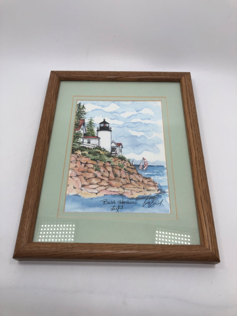 BASS HARBOUR LIGHT PAINTING IN TAN FRAME.