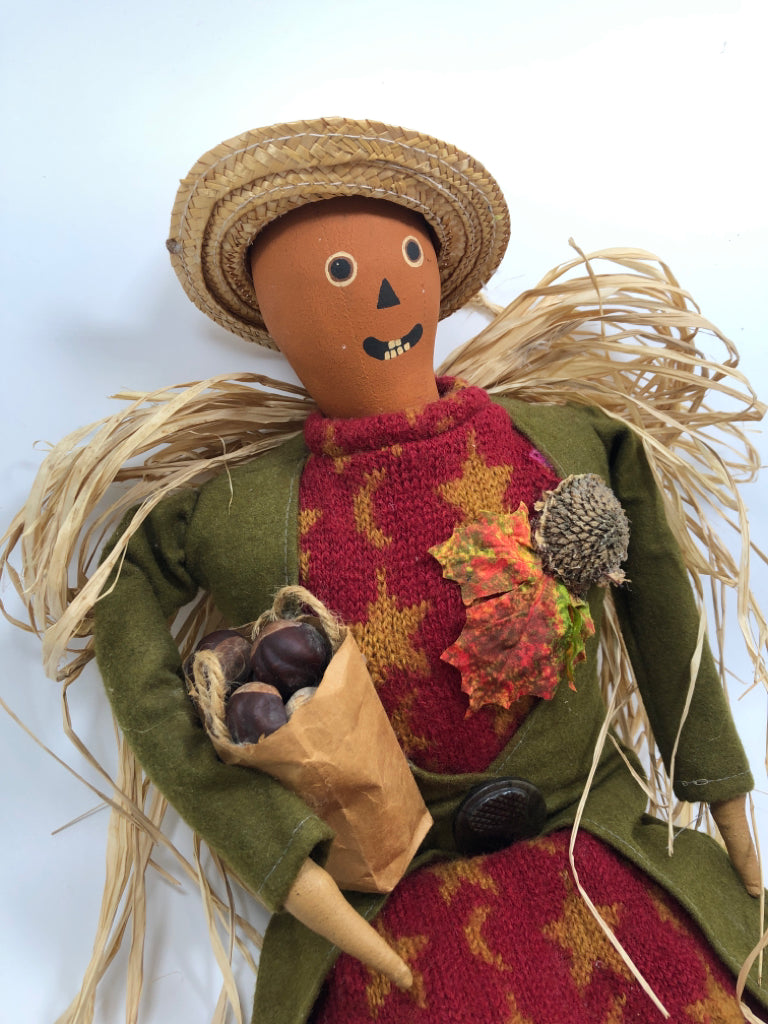 SCARECROW WOMAN W/BAG OF CHESTNUTS.