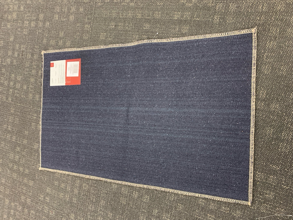 TERRACOTTA/BLUE RUG.