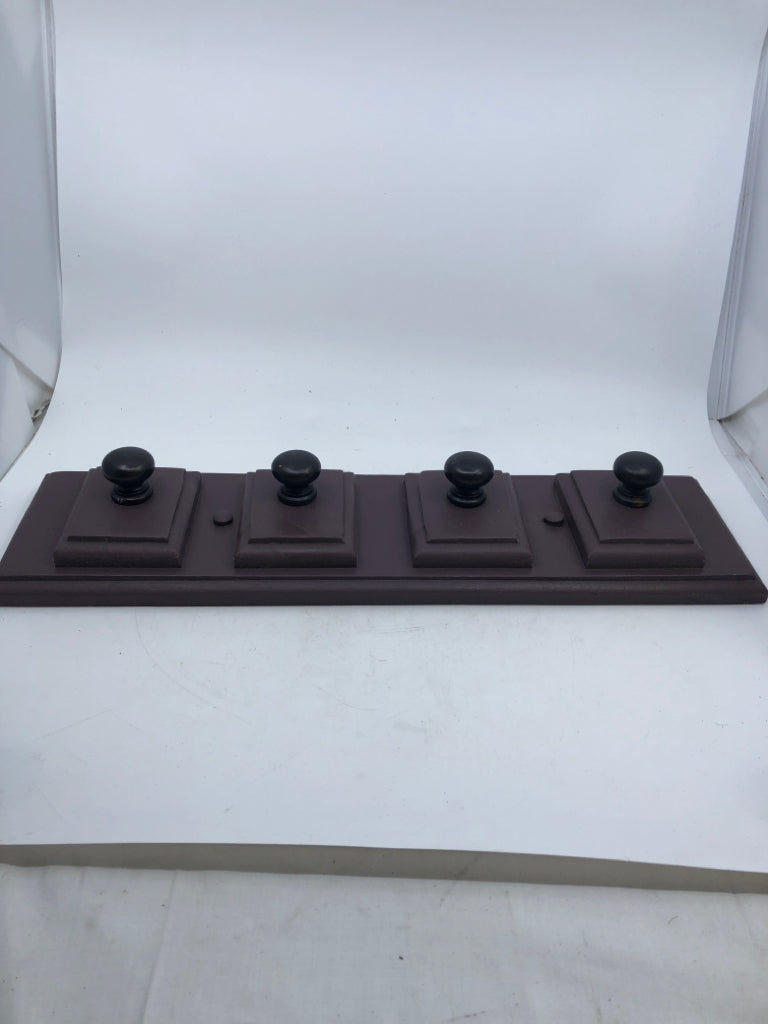 PURPLE WOOD SLATE W/ 4 BLACK KNOBS WALL HANGING.