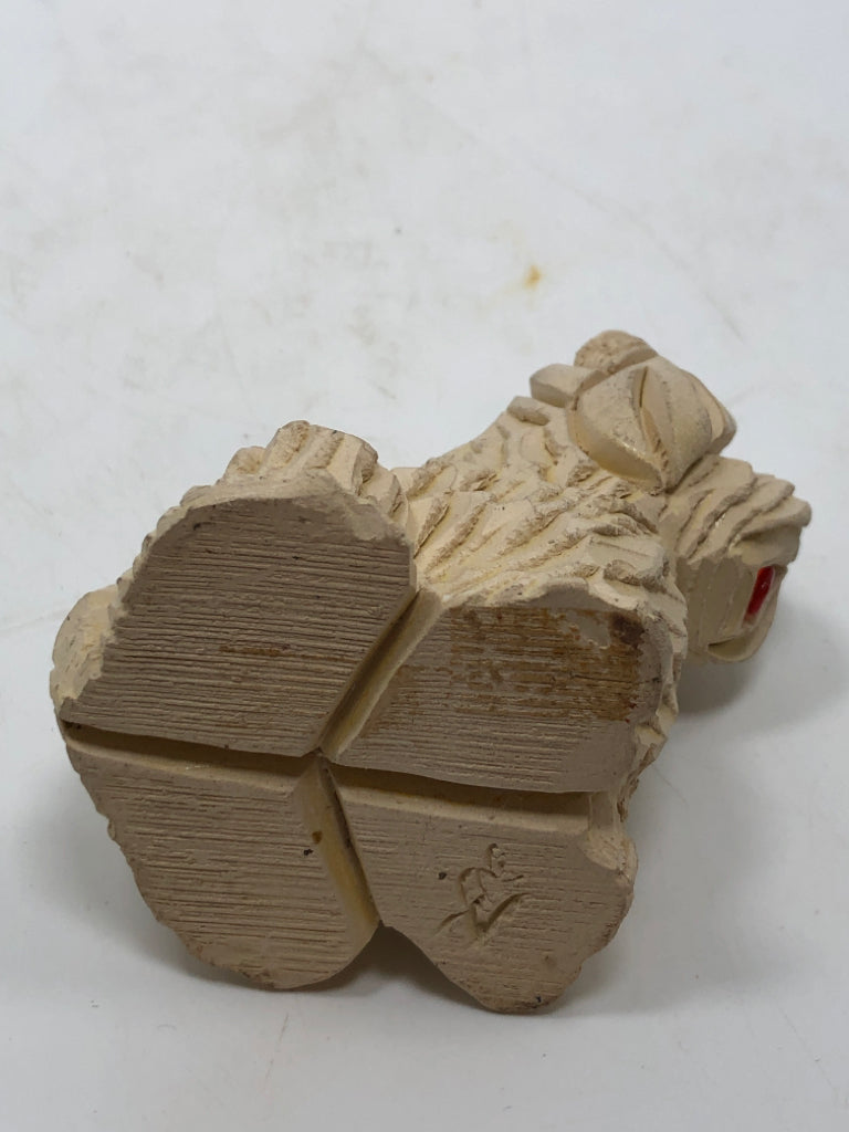 SM CARVED DOG W/TONGUE OUT.