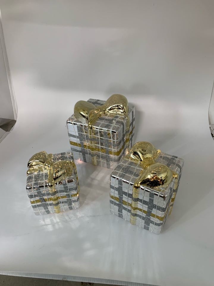 3 LIGHT UP MERCURY GLASS WRAPPED PRESENTS W/ GOLD RIBBON.