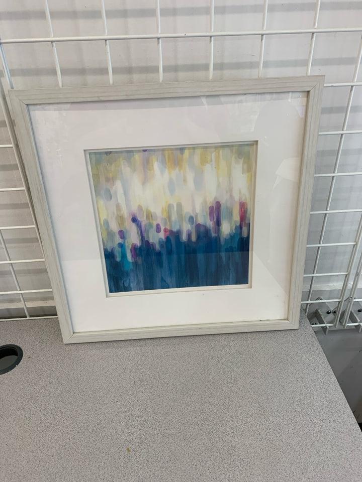 ABSTRACT BLUE YELLOW DRIPS IN WHITE FRAME.