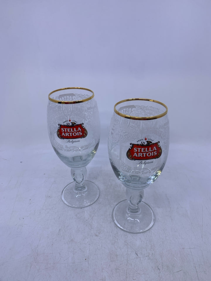 2 STELLA ARTOIS BEER GLASSES GOLD RIM.