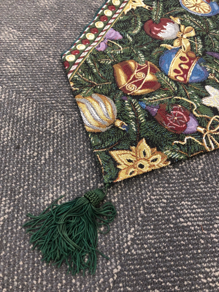 GREEN TABLE RUNNER WOVEN W/ COLORFUL ORNAMENTS.