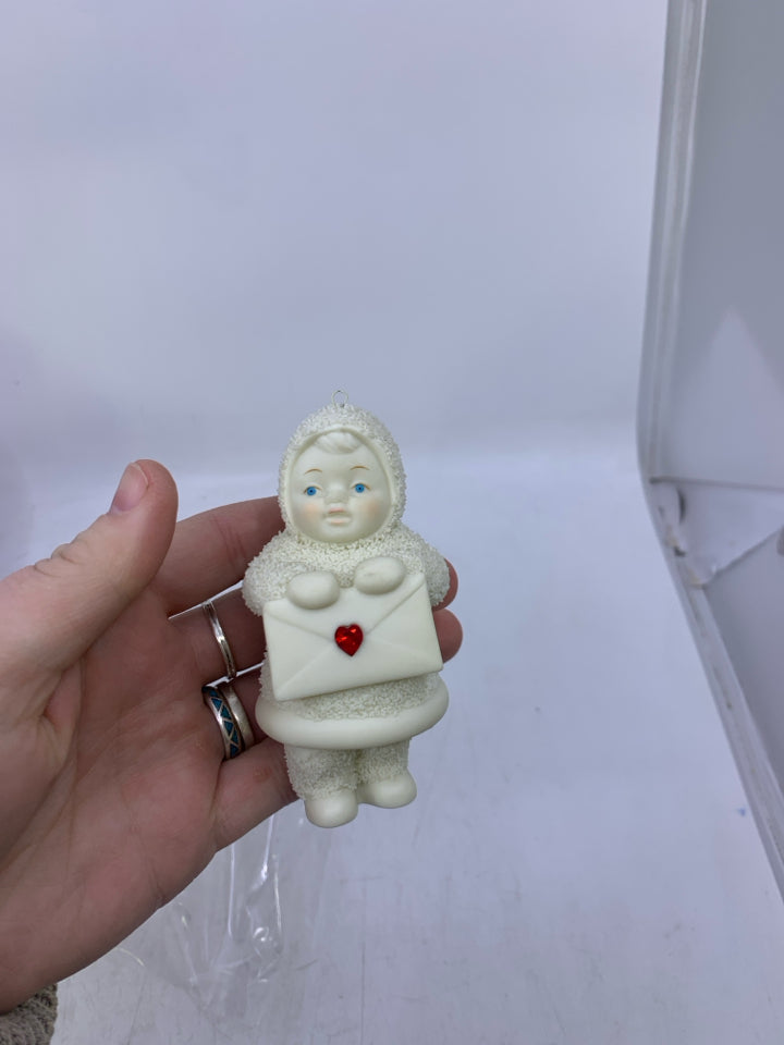 SNOWBABIES BABY HOLDING ENVELOPE W/ RED GEM IN BAG.