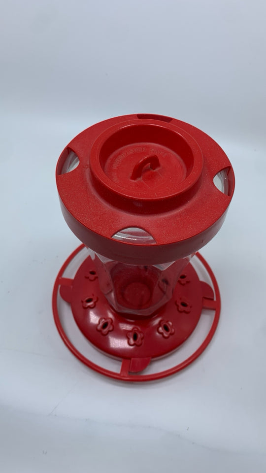 RED HUMMING BIRD FEEDER.