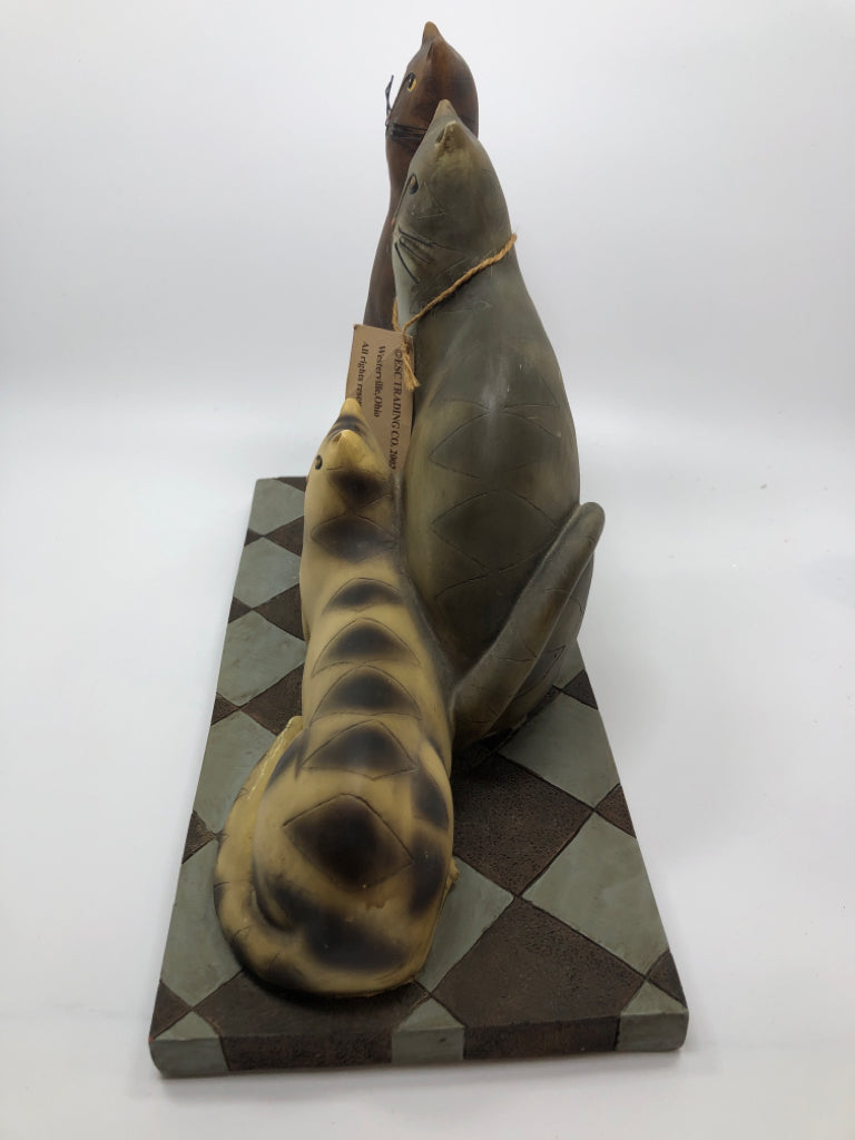 3 CATS ON CHECKERED BASE.