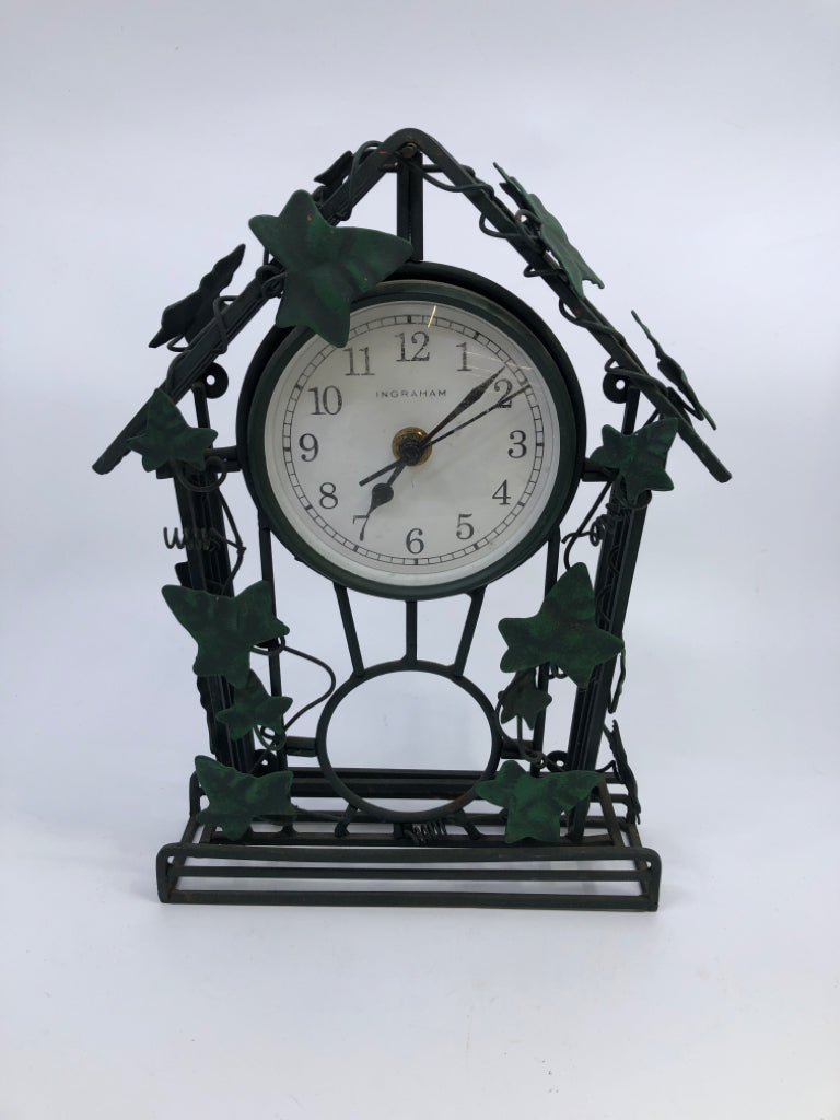 GREEN WIRE VINE CLOCK W/LEAVES.
