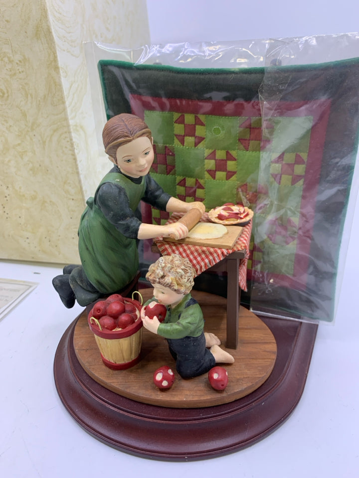 WOMAN MAKING PIES + QUILT.