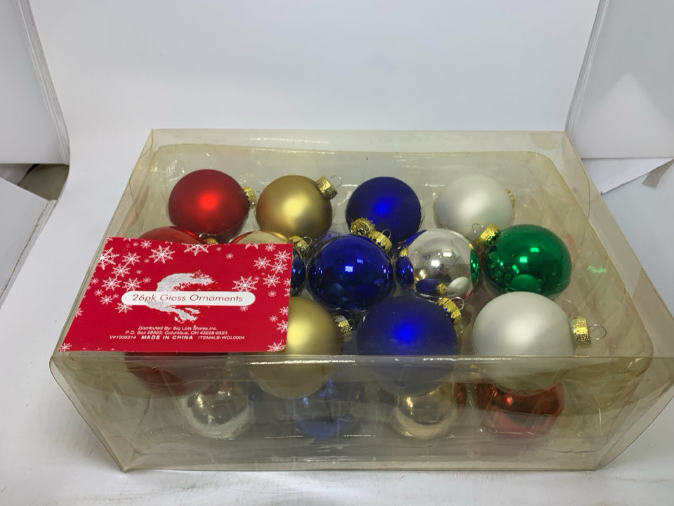 IN BOX 26 ASSORTED COLORS GLASS ORNAMENTS.
