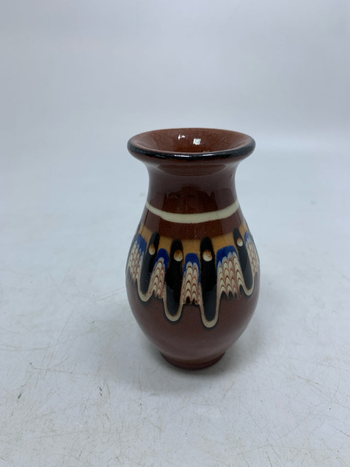 DARK BROWN TERRA COTTA BUD VASE W/ COLORFUL PATTERN.