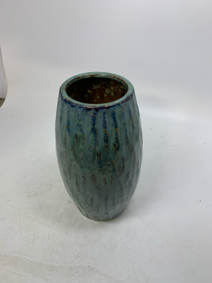 TEXTURED PALE BLUE CERAMIC VASE.