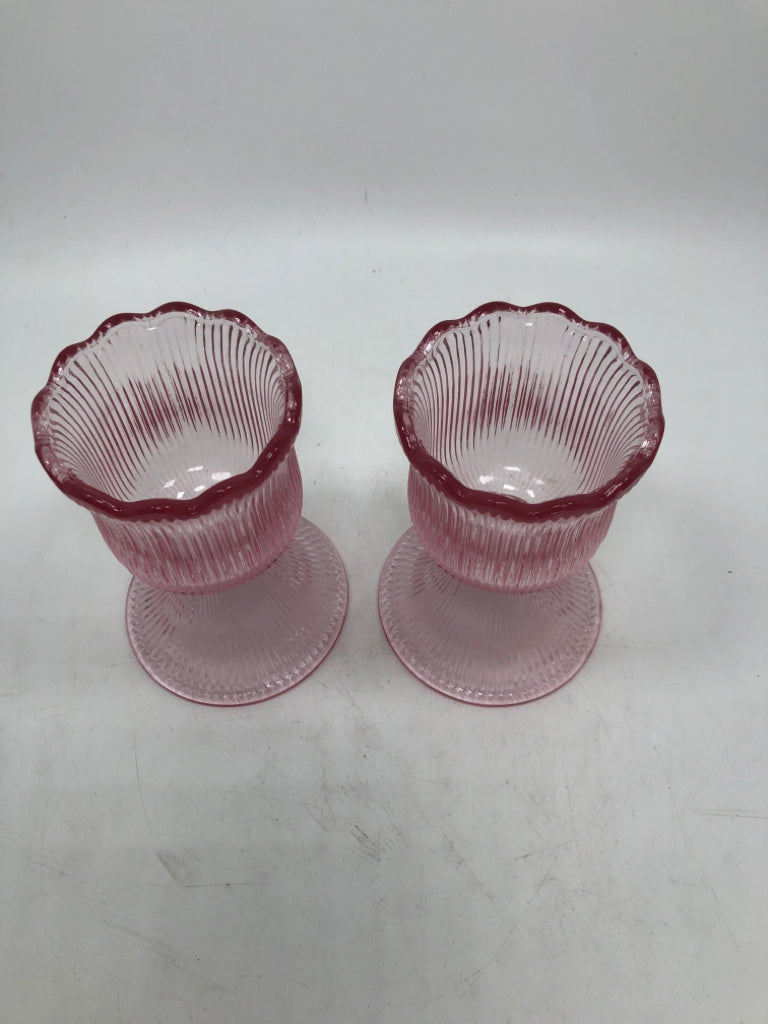 2 PINK RIBBED FLOWER SHAPED VOTIVE HOLDERS.