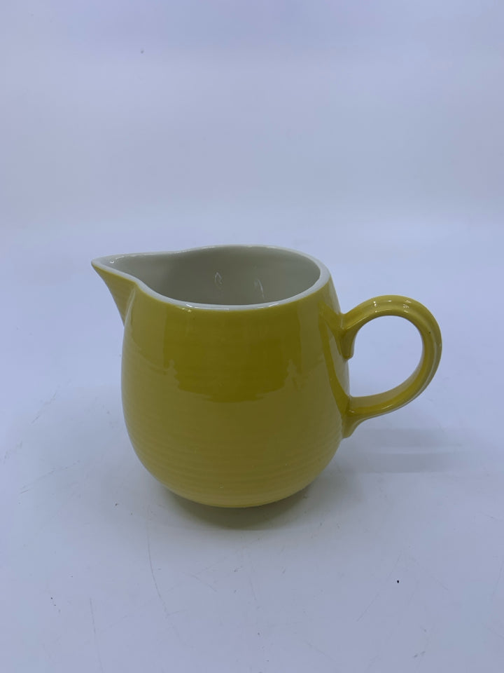 SMALL YELLOW RIBBED PITCHER.