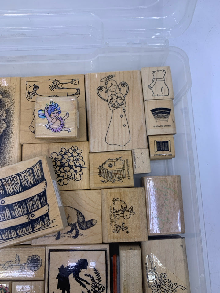 35 ASSORTED STAMPS IN CLEAR PLASTIC CASE.