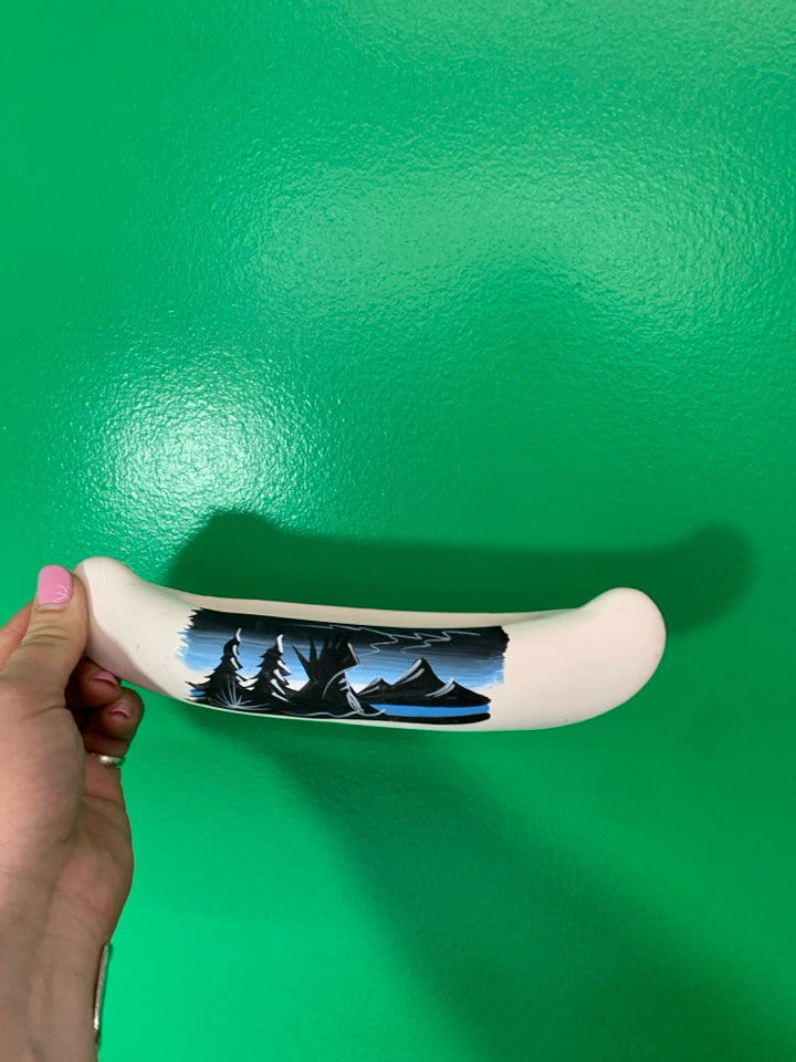 BLACK AND BLUE OVAL CANOE.