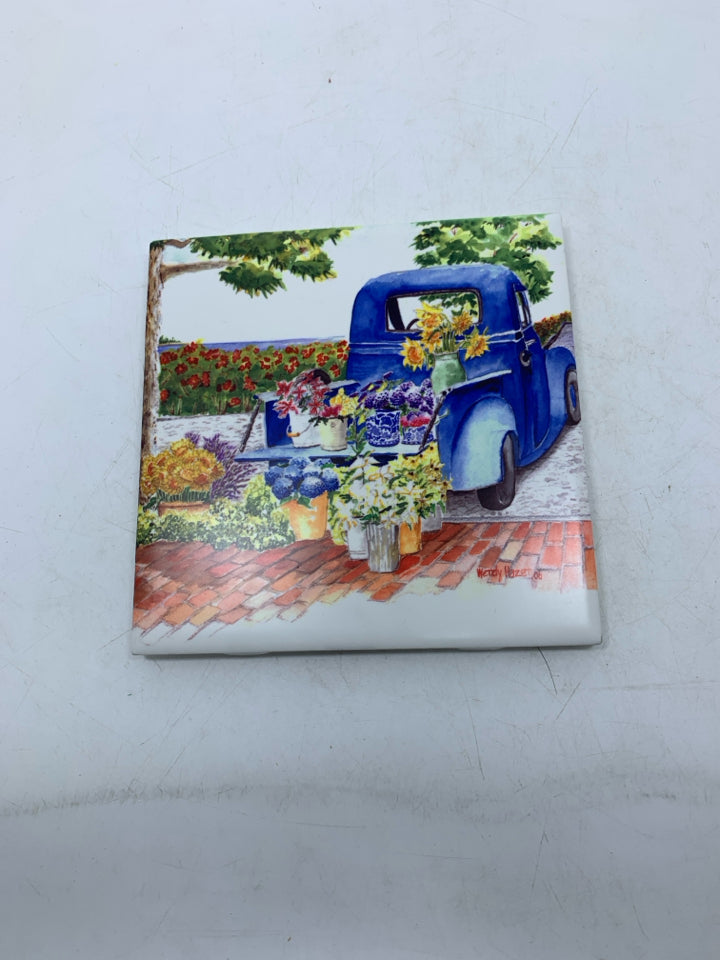BLUE FARMER'S TRUCK FLORAL CERAMIC TILE WALL HANGING.