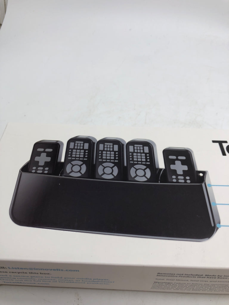 NIB TOTAL MOUNT REMOVABLE REMOTE HOLDER.