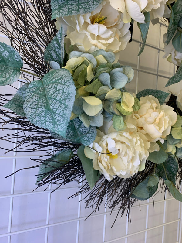 WHITE FLORAL AND GREENERY WREATH.