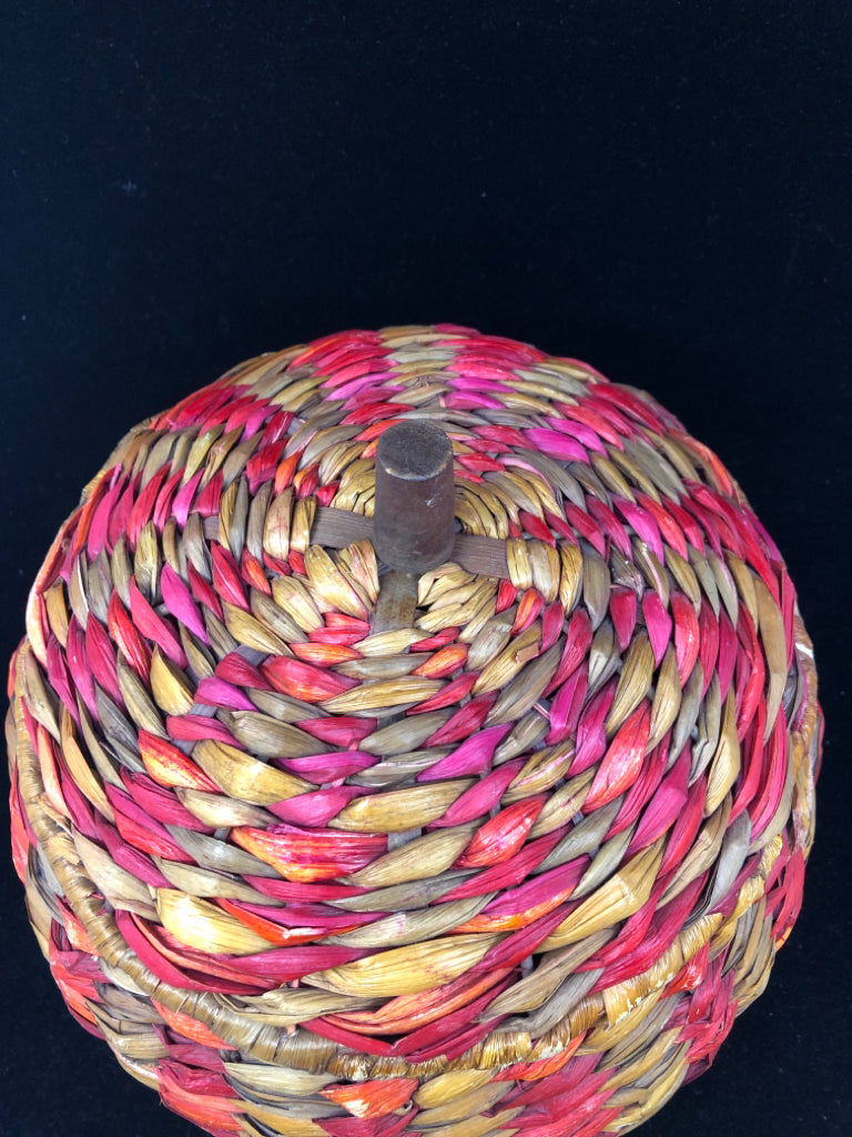 MULTI COLORED WOVEN COVERED BASKET.