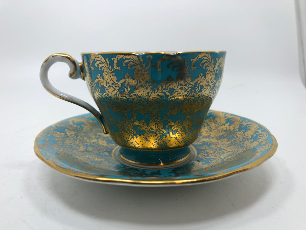 VTG GOLD FILIGREE TURQUOISE TEACUP AND SAUCER.