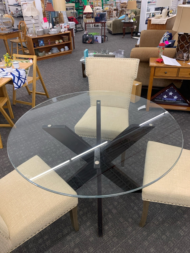DARK WOOD X BASE TABLE WITH GLASS TOP 3 CREAM NAIL HEAD CHAIRS.
