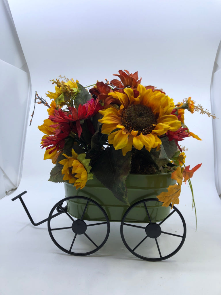 FAUX FALL BOUQUET IN GREEN METAL WAGON.