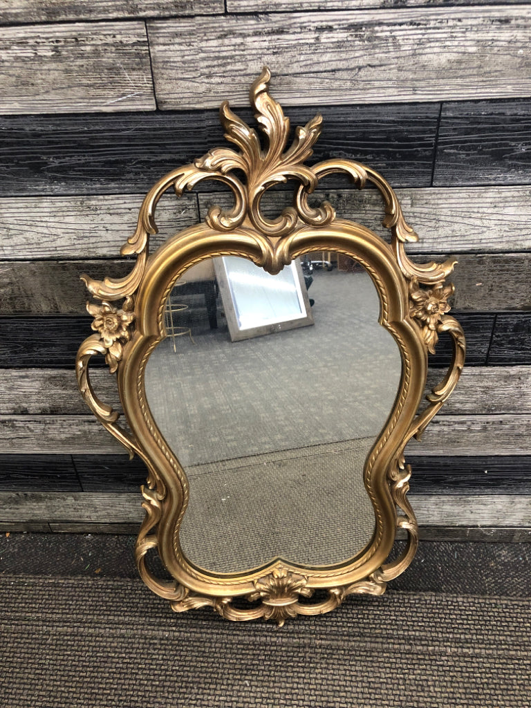 GOLD ORNATE MIRROR.
