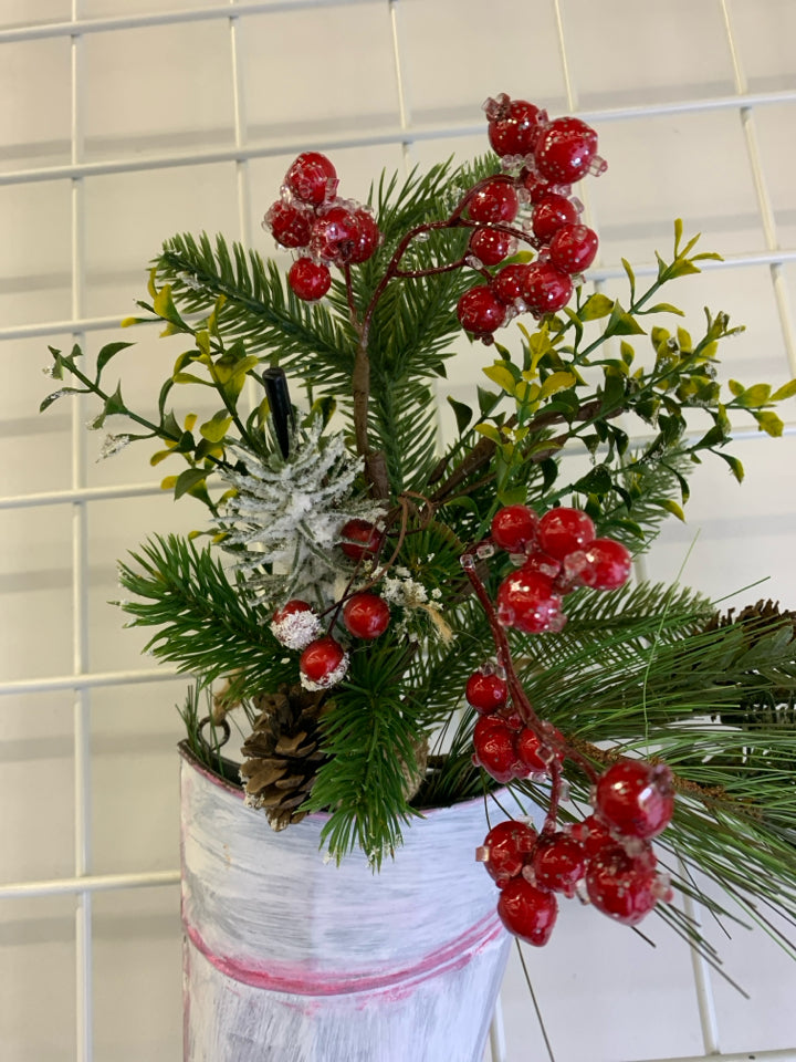 METAL STOCKING PAINTED WHITE W/ HOLLY AND GREENERY.