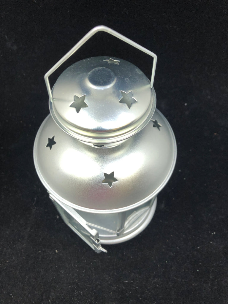 SILVER LANTERN STAR CUTOUT CANDLE HOLDER.
