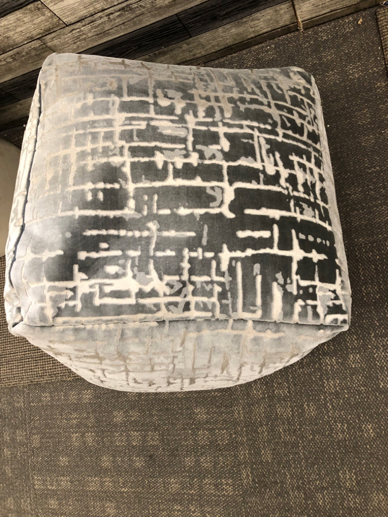 LARGE GREY OTTOMAN CUBE W/CUTOUT DETAILS.