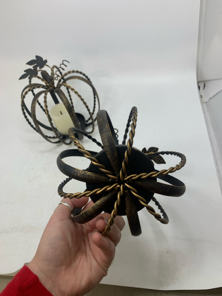 2 METAL PUMPKIN CAGE PILLAR CANDLE HOLDERS BRONZE W/ FAUX CANDLES.