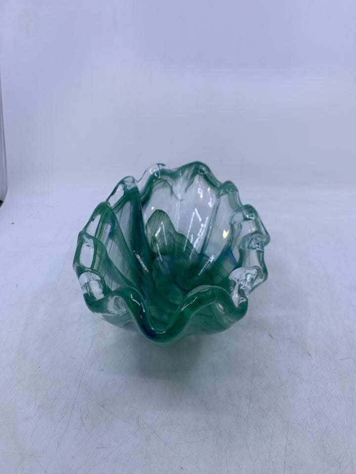 ABSTRACT OVAL GLASS W/ GREEN SWIRLS.