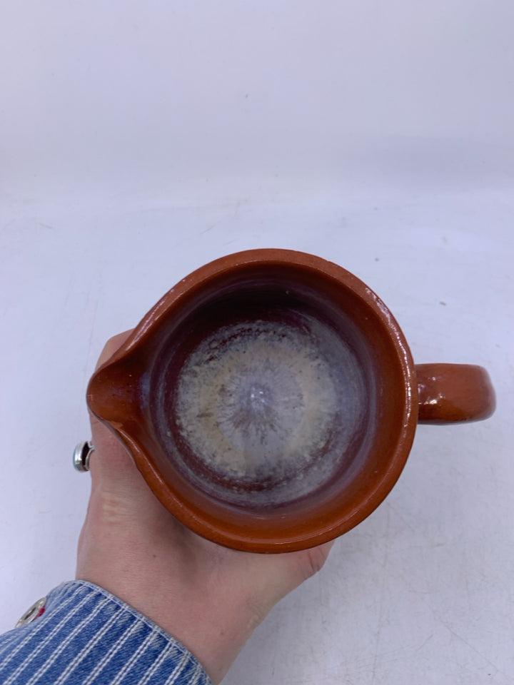 SMALL POTTERY PITCHER.