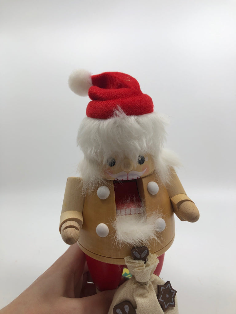 RG GERMAN- SANTA NUT CRACKER W/ BAG OF COOKIES.